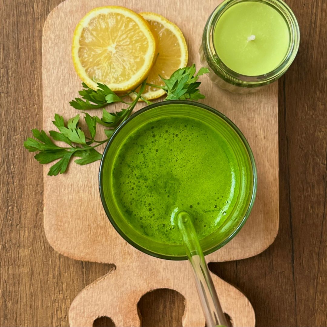 Detox juice bottles contrasted with whole, nourishing PCOS-friendly foods